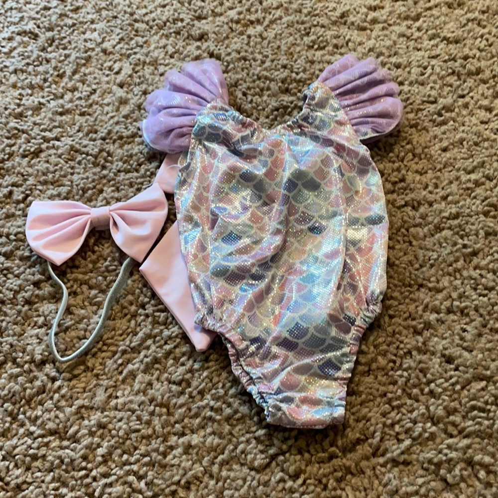 NWOT infant swim suit and matching head now. Size 70